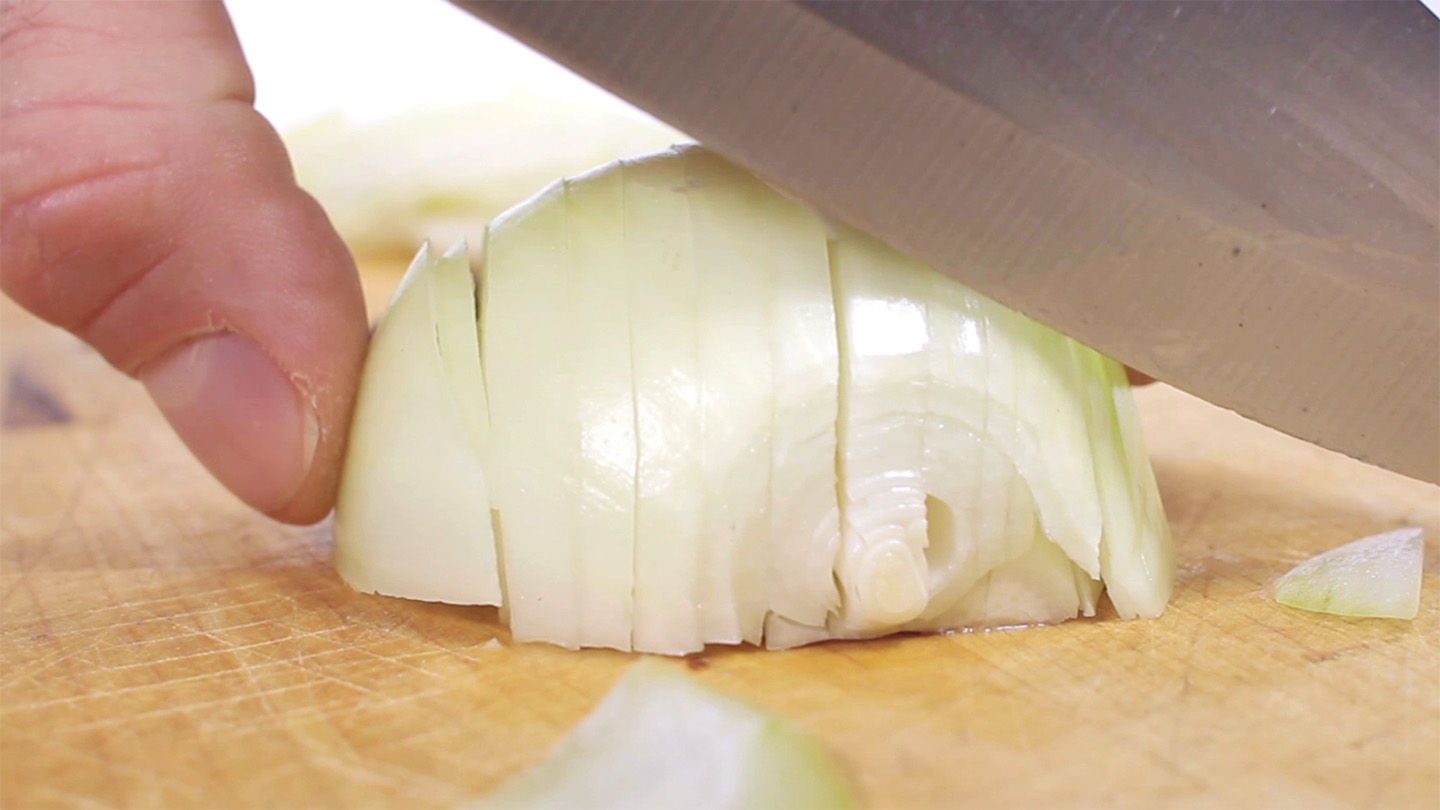 A chemical in flying onion juice is the culprit for a cook’s stinging tears. Changing how the onion is chopped can eliminate those tears. chiinka/Creatas Video+/Getty Images Plus